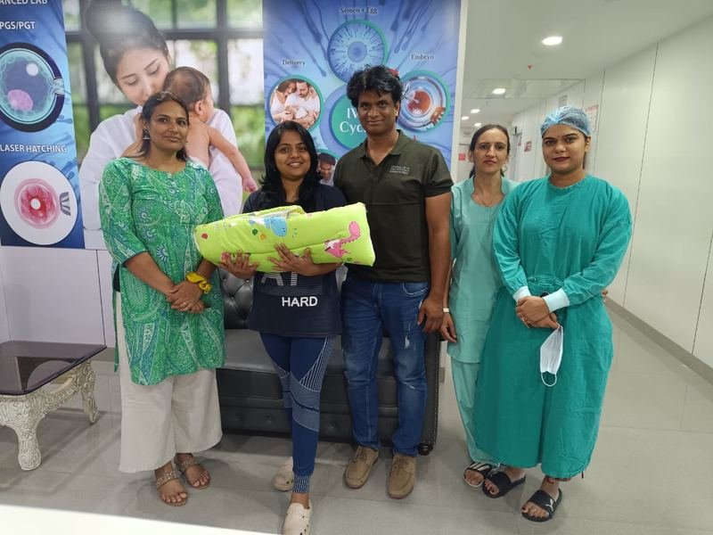 A couple with their baby after a successful fertility journey