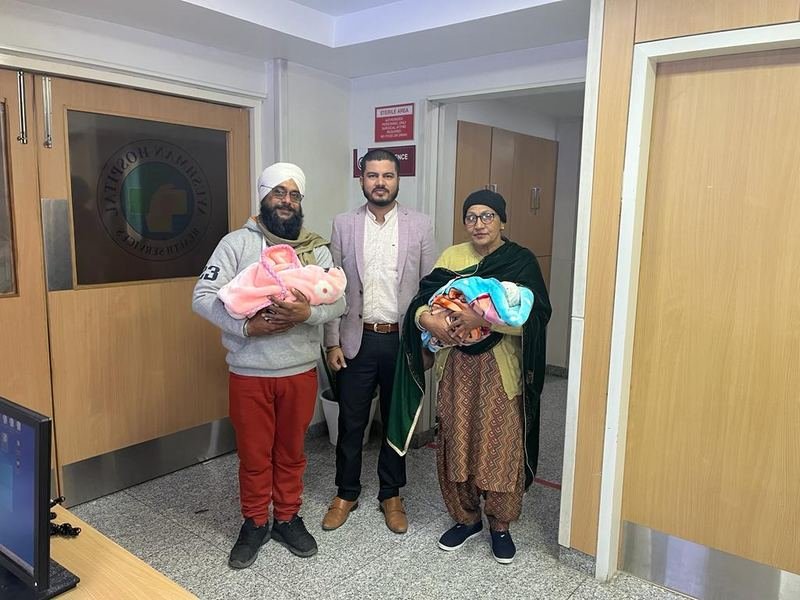 A family with their newborn twins